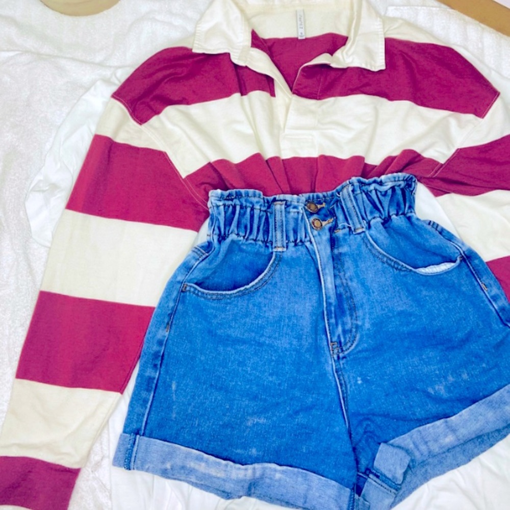 A  dull red and white vintage long sleeve with collar  .